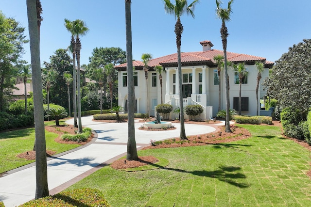 2940 Pine Valley Dr, Miramar Beach, FL 32550 - mediterranean / spanish-style home featuring a front yard, a tiled roof, and stucco siding