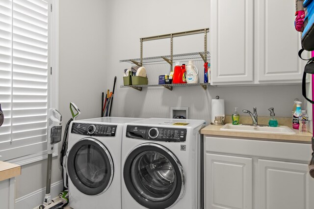 2940 Pine Valley Dr, Miramar Beach, FL 32550 - washroom featuring separate washer and dryer, a sink, and cabinet space