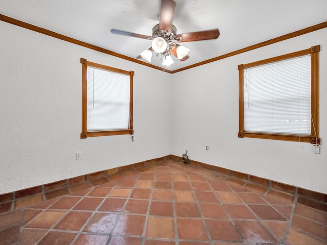 unfurnished room featuring tile patterned flooring, crown molding, baseboards, and ceiling fan