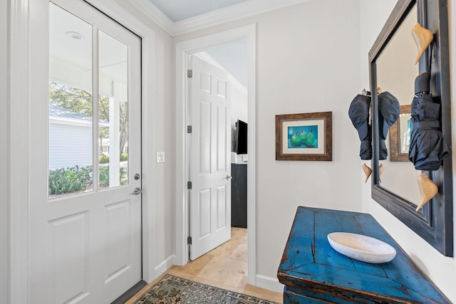 interior space featuring baseboards and ornamental molding