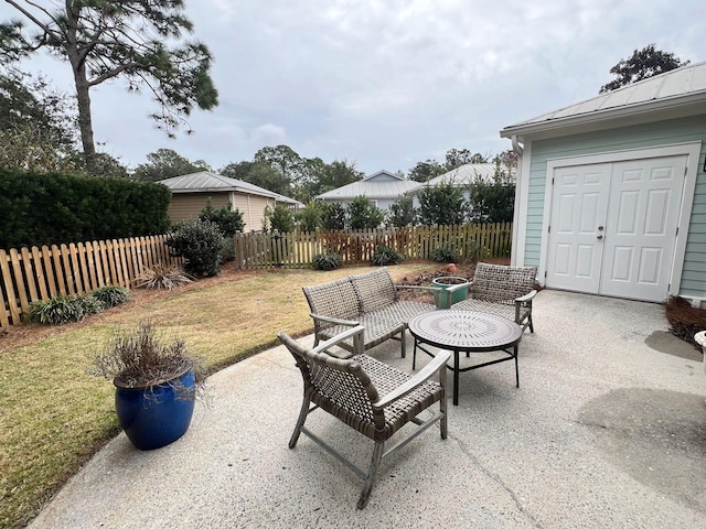 view of patio / terrace featuring fence