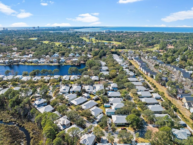 drone / aerial view featuring a water view and a residential view