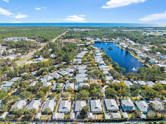 drone / aerial view featuring a residential view and a water view