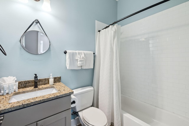 full bath featuring shower / bath combo with shower curtain, toilet, and vanity