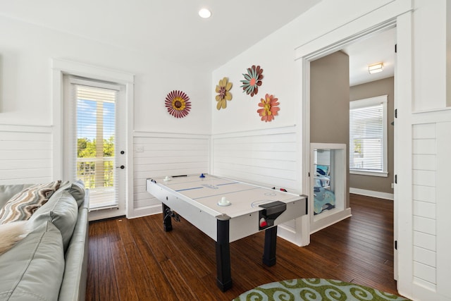 game room featuring hardwood / wood-style floors and a wainscoted wall