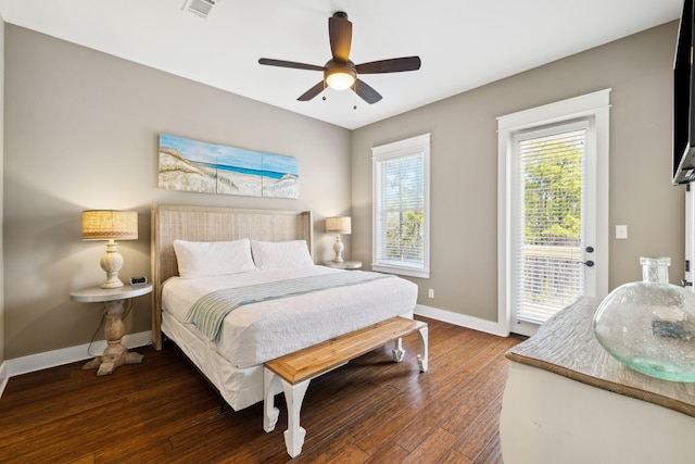 bedroom with wood finished floors, visible vents, baseboards, ceiling fan, and access to outside