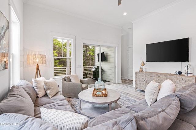 living room with a ceiling fan, wood finished floors, recessed lighting, crown molding, and baseboards