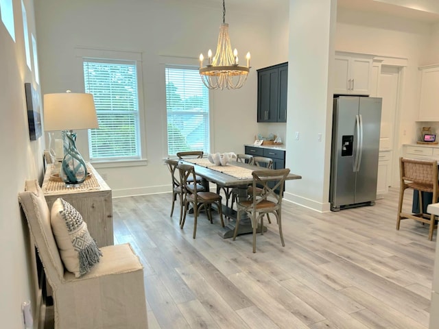 150 Grande Pointe Cir, Inlet Beach, FL 32461 - dining room featuring a chandelier, light wood finished floors, and baseboards