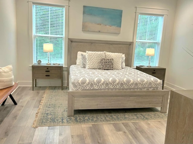 150 Grande Pointe Cir, Inlet Beach, FL 32461 - bedroom with wood finished floors and multiple windows