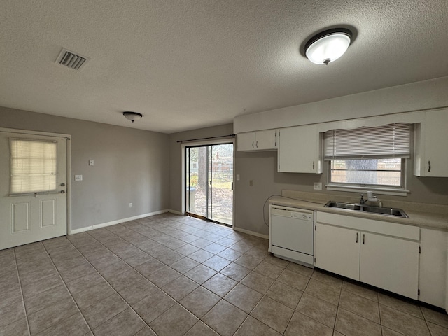 kitchen with a sink, white cabinets, visible vents, and white dishwasher