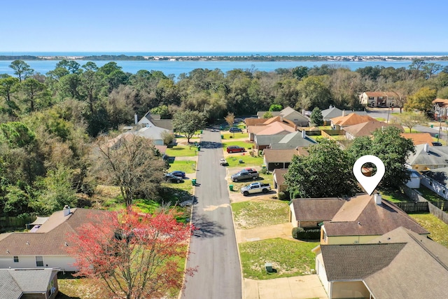 bird's eye view featuring a residential view and a water view