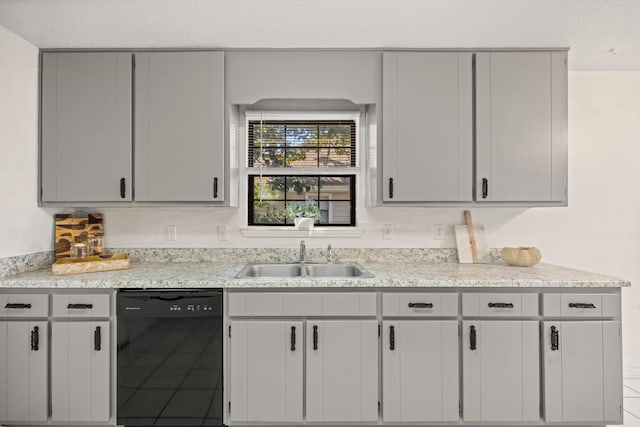 kitchen featuring gray cabinets, black dishwasher, and a sink