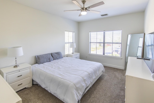 bedroom featuring visible vents, baseboards, a ceiling fan, and carpet flooring