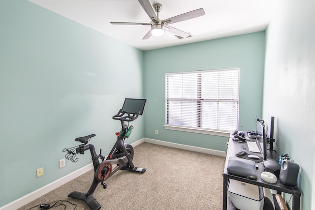 workout area with a ceiling fan, carpet, and baseboards