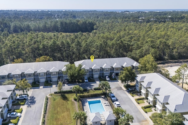 birds eye view of property with a forest view and a residential view