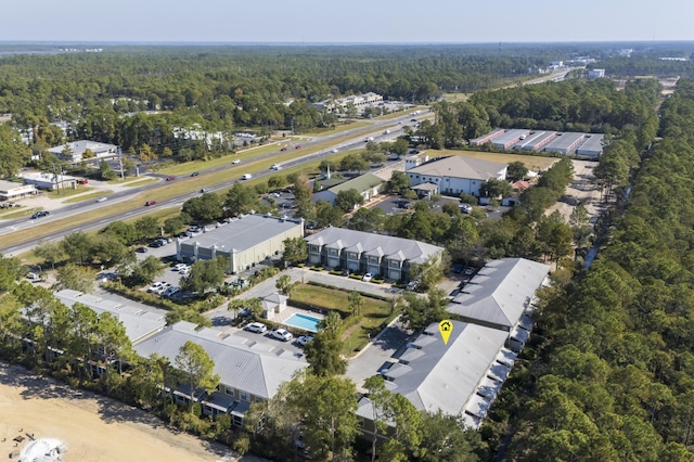 bird's eye view featuring a forest view