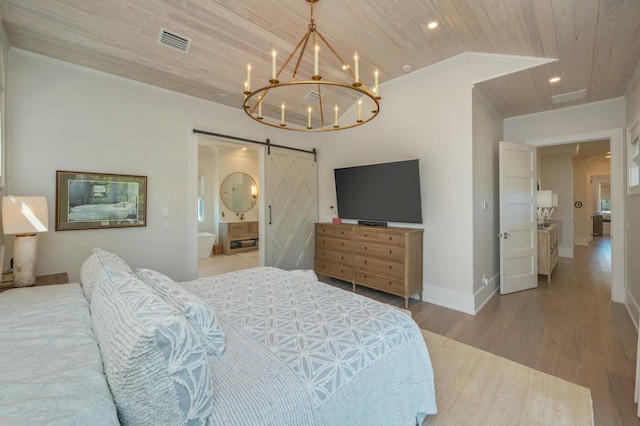 bedroom with visible vents, wood finished floors, a barn door, an inviting chandelier, and wood ceiling