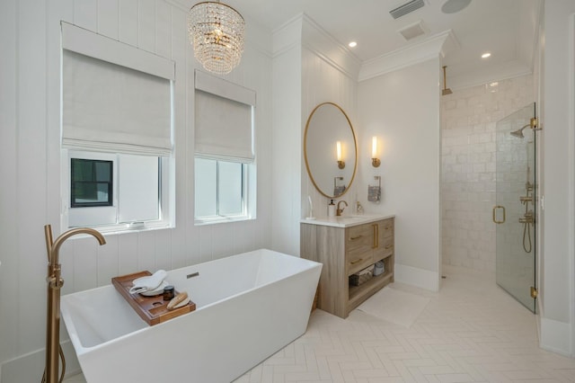 bathroom with vanity, visible vents, a soaking tub, a shower stall, and a notable chandelier