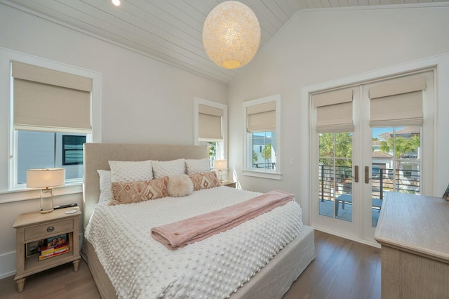 bedroom featuring french doors, wood finished floors, lofted ceiling, and access to outside