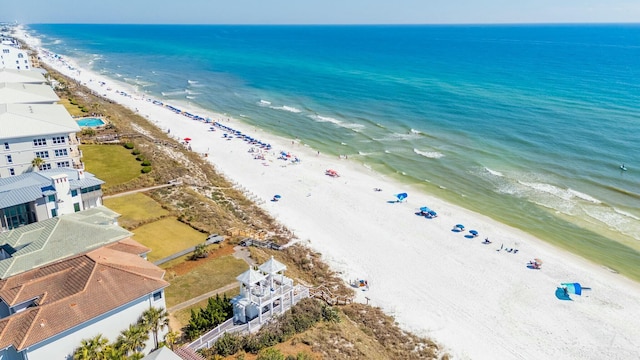 bird's eye view featuring a beach view and a water view