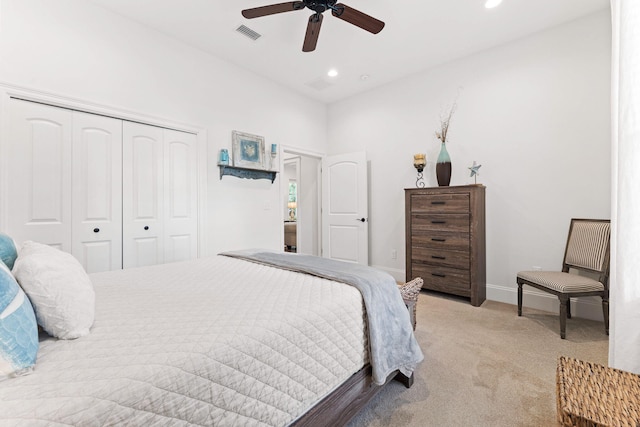 bedroom featuring recessed lighting, visible vents, light carpet, and a closet