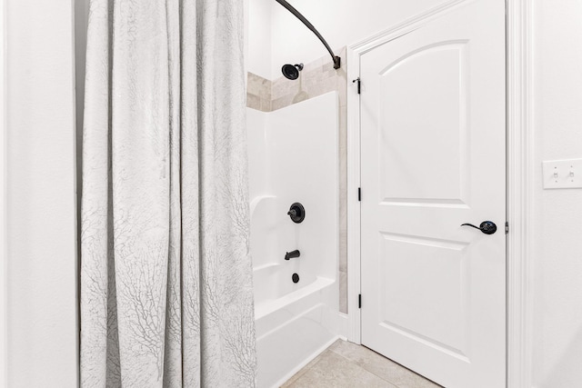 bathroom featuring tile patterned floors and shower / bathtub combination with curtain