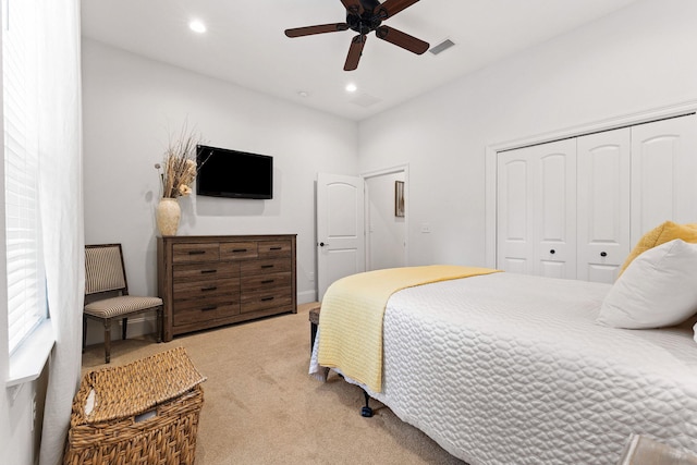 carpeted bedroom with a closet, visible vents, recessed lighting, and a ceiling fan