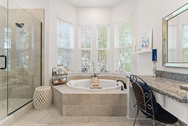 full bathroom featuring a wealth of natural light, tile patterned flooring, a shower stall, and a bath