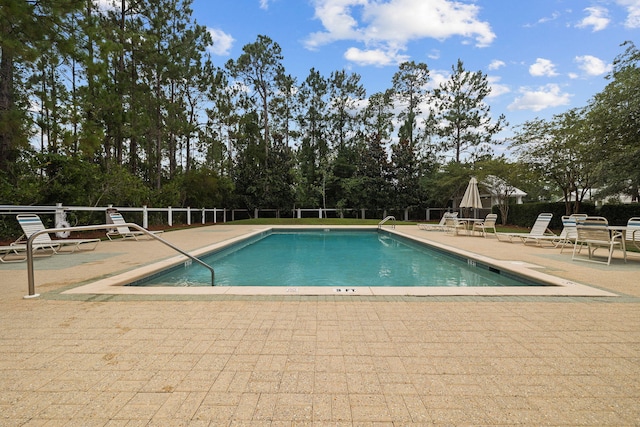 pool with a patio area