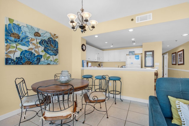 dining room with light tile patterned floors, visible vents, baseboards, recessed lighting, and a notable chandelier