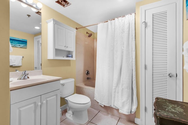 bathroom with shower / bath combo with shower curtain, toilet, a closet, tile patterned floors, and vanity