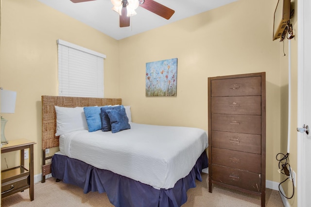 bedroom featuring baseboards, carpet floors, and a ceiling fan