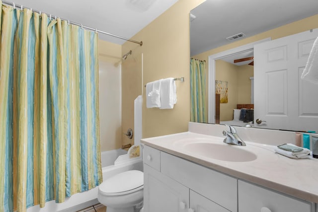 full bath with vanity, shower / bath combination with curtain, toilet, and visible vents