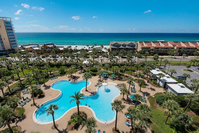 view of swimming pool featuring a water view