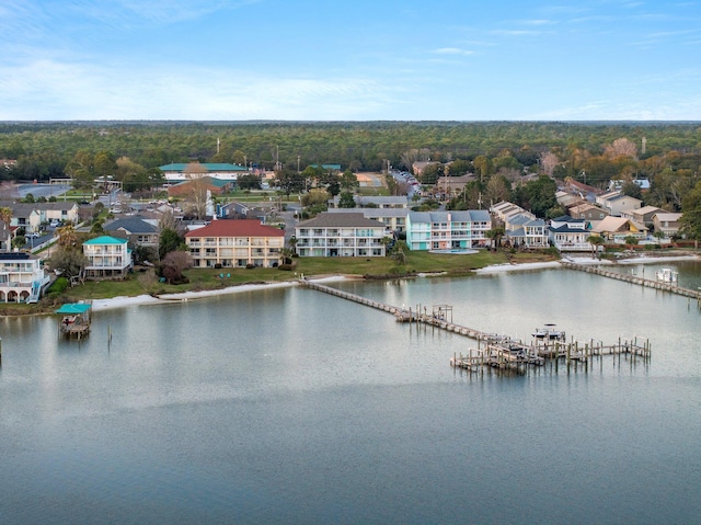 birds eye view of property with a residential view and a water view