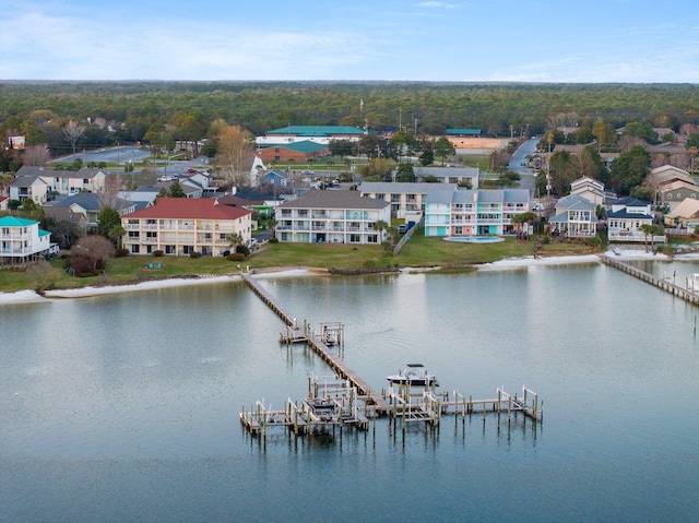 drone / aerial view with a residential view and a water view