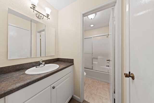 bathroom featuring combined bath / shower with glass door, toilet, vanity, and tile patterned flooring