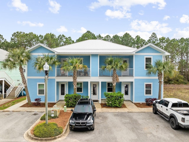 view of front of house featuring a balcony