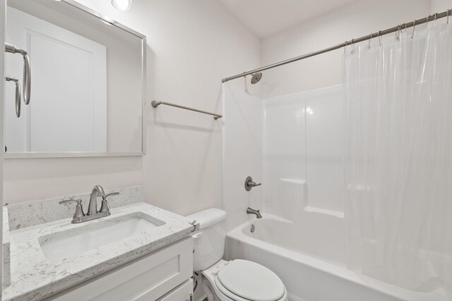 full bath with toilet, shower / tub combo with curtain, and vanity