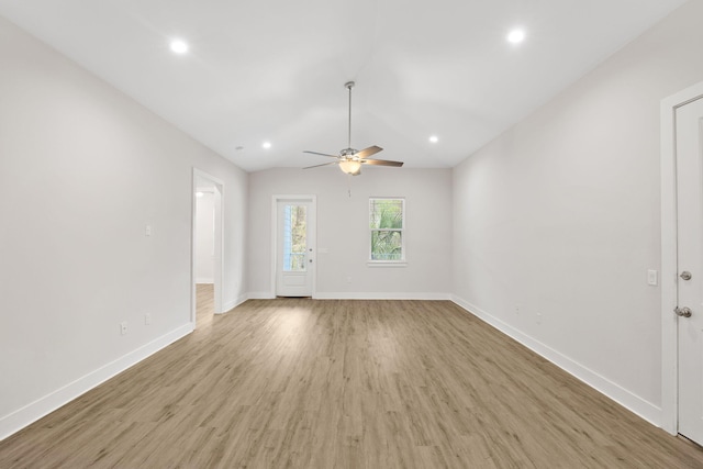 unfurnished living room featuring wood finished floors, baseboards, a ceiling fan, recessed lighting, and lofted ceiling