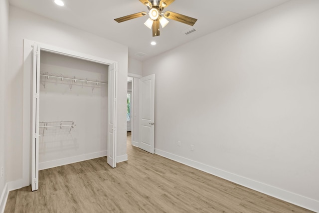 unfurnished bedroom with light wood-style flooring, baseboards, recessed lighting, a closet, and a ceiling fan
