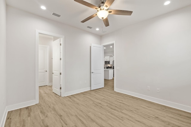 unfurnished bedroom featuring light wood-style floors, recessed lighting, baseboards, and a ceiling fan