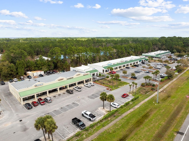 aerial view of a commercial area and a forest
