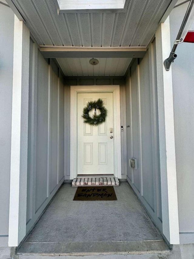 view of exterior entry with board and batten siding