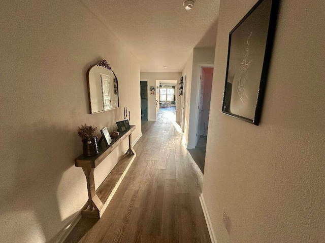 hall featuring wood finished floors