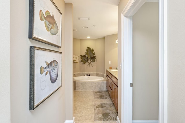 full bath featuring recessed lighting, a bath, and vanity