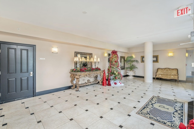 entrance foyer featuring tile patterned floors and baseboards