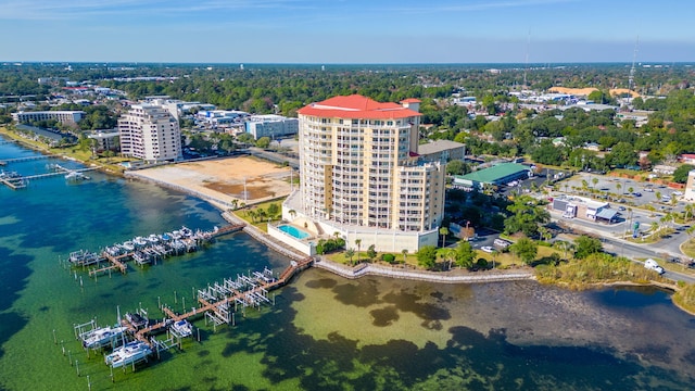 birds eye view of property with a city view and a water view