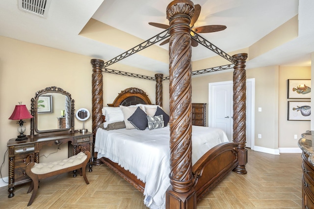 bedroom with visible vents, baseboards, and ceiling fan