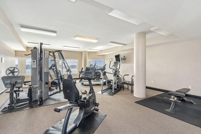 gym featuring baseboards